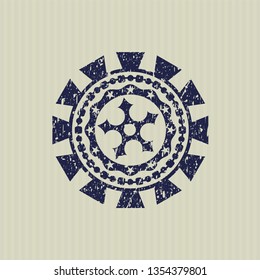 Blue ninja star icon inside distress rubber stamp