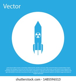 Blue Nuclear rocket icon isolated on blue background. Rocket bomb flies down. White circle button. Vector Illustration