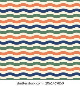 Blue , orange and green waves seamless pattern. Minimalist and childish design for fabric, textile, wallpaper, bedding, swaddles or gender-neutral apparel.