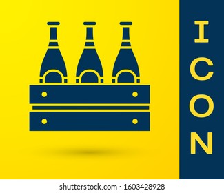 Blue Pack of beer bottles icon isolated on yellow background. Wooden box and beer bottles. Case crate beer box sign.  Vector Illustration