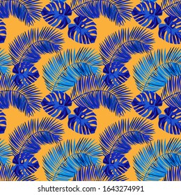 Blue palm and monstera leaves  on an orange background. Seamless tropical vector pattern.