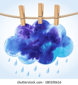 Blue paper cloud hanging by clothes peg on a clothesline