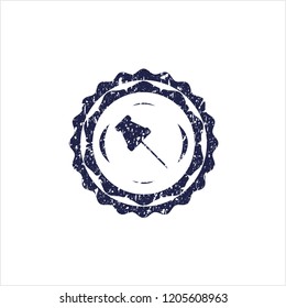 Blue paper pin icon inside distressed rubber stamp with grunge texture