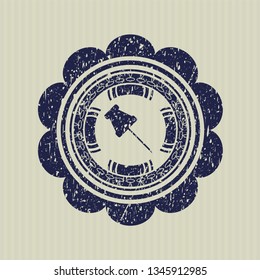 Blue paper pin icon inside distressed rubber seal