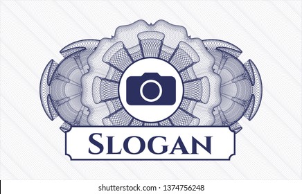 Blue passport style rosette with photo camera icon and Slogan text inside
