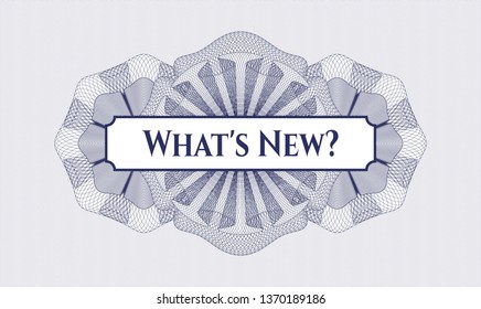 Blue passport style rosette with text What's New? inside