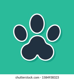 Blue Paw print icon isolated on green background. Dog or cat paw print. Animal track.  Vector Illustration