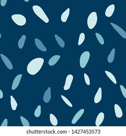 Blue pebble seamless pattern on background. Abstract geometric dotted wallpaper. Random stones backdrop. Vector illustration