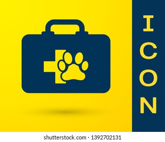 Blue Pet first aid kit icon isolated on yellow background. Dog or cat paw print. Clinic box. Vector Illustration