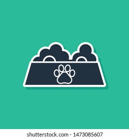 Blue Pet food bowl for cat or dog icon isolated on green background. Dog or cat paw print.  Vector Illustration