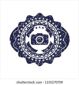 Blue photo camera icon inside grunge seal