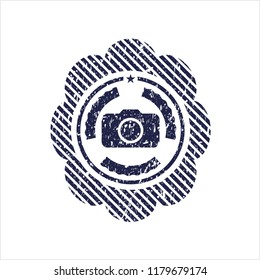 Blue photo camera icon inside rubber grunge texture seal