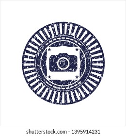 Blue photo camera icon inside distressed grunge stamp