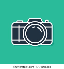 Blue Photo camera icon isolated on green background. Foto camera icon.  Vector Illustration