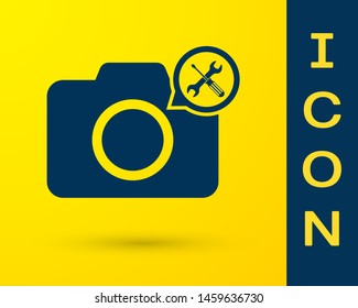 Blue Photo camera with screwdriver and wrench icon isolated on yellow background. Adjusting, service, setting, maintenance, repair, fixing.  Vector Illustration