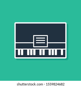Blue Piano icon isolated on green background. Musical instrument.  Vector Illustration