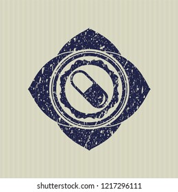 Blue pill icon inside distressed grunge seal