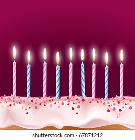 blue and pink candles on a birthday cake