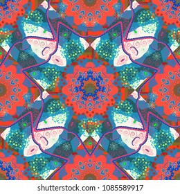 Blue, pink and green ethnic geometric motif seamless pattern on colorful abstract background. Vector illustration.