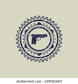 Blue pistol icon inside distressed rubber stamp with grunge texture
