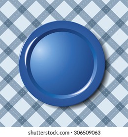 Blue plate on tablecloth