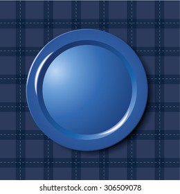 Blue plate on tablecloth