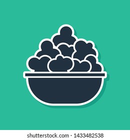Blue Popcorn in bowl icon isolated on green background. Popcorn bucket box.  Vector Illustration