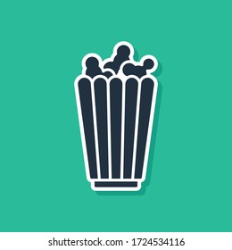 Blue Popcorn in cardboard box icon isolated on green background. Popcorn bucket box.  Vector Illustration