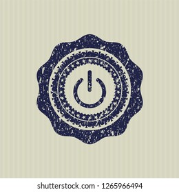 Blue power icon inside rubber grunge texture seal