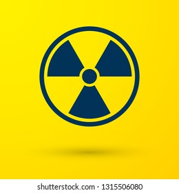 Blue Radioactive icon isolated on yellow background. Radioactive toxic symbol. Radiation Hazard sign. Vector Illustration