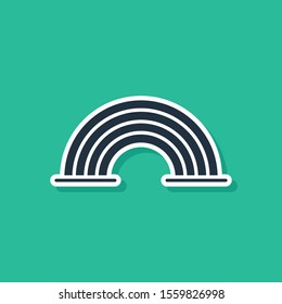 Blue Rainbow with clouds icon isolated on green background.  Vector Illustration