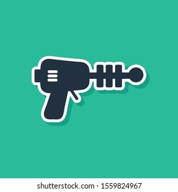 Blue Ray gun icon isolated on green background. Laser weapon. Space blaster.  Vector Illustration