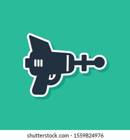 Blue Ray gun icon isolated on green background. Laser weapon. Space blaster.  Vector Illustration