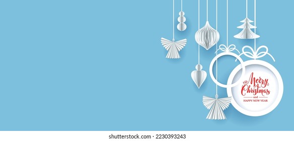 Blue realistic paper cut banner with baubles, angels and snowflakes. Seasonal winter background with Marry Christmas inscription