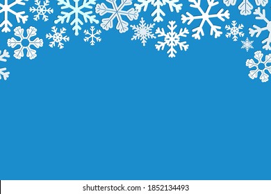 Blue rectangular horizontal background with white snowflakes along the top edge. Imitation of paper decorations, origami, border, limiter, frame. Winter festive decoration.