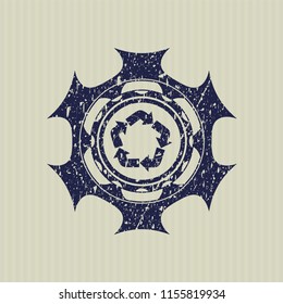 Blue recycle icon inside distressed grunge style stamp