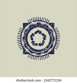 Blue recycle icon inside distressed rubber seal with grunge texture