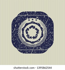 Blue recycle icon inside distressed rubber grunge seal