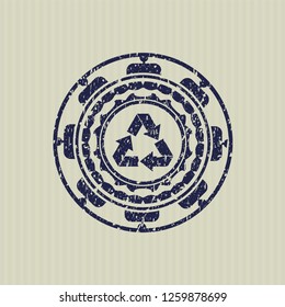 Blue recycle icon inside rubber grunge seal