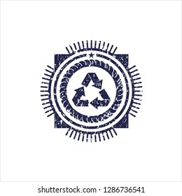Blue recycle icon inside rubber grunge stamp