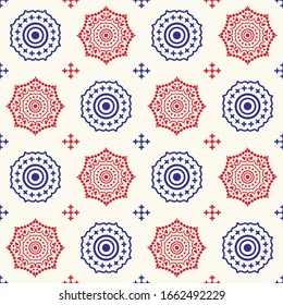 Blue and red color mandala seamless pattern for wallpaper, wrapping and textile on light background. Contemporary motif endless fabric for tile.