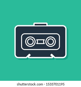 Blue Retro audio cassette tape icon isolated on green background.  Vector Illustration