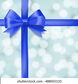 blue ribbon bow on blurry background. greeting vector design template