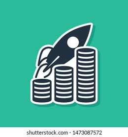 Blue Rocket flying up on coins growth chart icon isolated on green background. Graph that shows increase in sales.  Vector Illustration