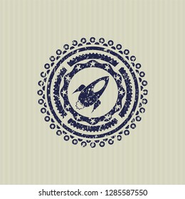 Blue rocket icon inside distress rubber texture