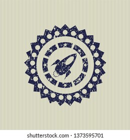 Blue rocket icon inside distress rubber grunge stamp