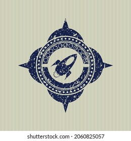 Blue rocket icon inside distressed rubber grunge texture seal. 