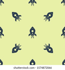Blue Rocket ship with fire icon isolated seamless pattern on yellow background. Space travel.  Vector Illustration