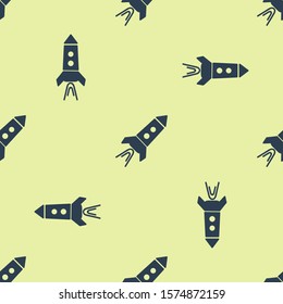 Blue Rocket ship with fire icon isolated seamless pattern on yellow background. Space travel.  Vector Illustration