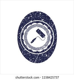 Blue roller brush icon inside distress rubber grunge seal